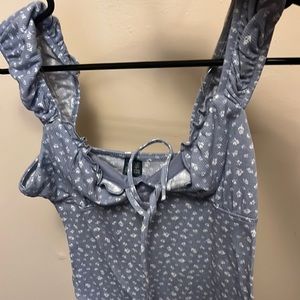 One she is tank top blue with flowers on